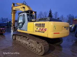 New Holland 349 Kobelco E385 — Foto 2