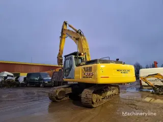 New Holland 349 Kobelco E385 — Foto 5