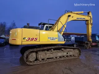 New Holland 349 Kobelco E385 — Foto 9