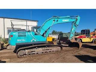 Kobelco 315 SK210LC — Foto 6