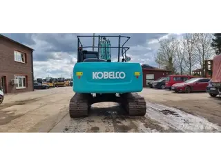 Kobelco 1304 SK210LC-9 — Foto 4