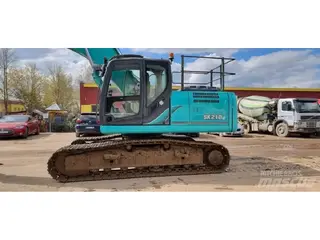 Kobelco 1304 SK210LC-9 — Foto 9