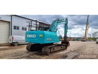 Kobelco 1304 SK210LC-9 — Foto 10